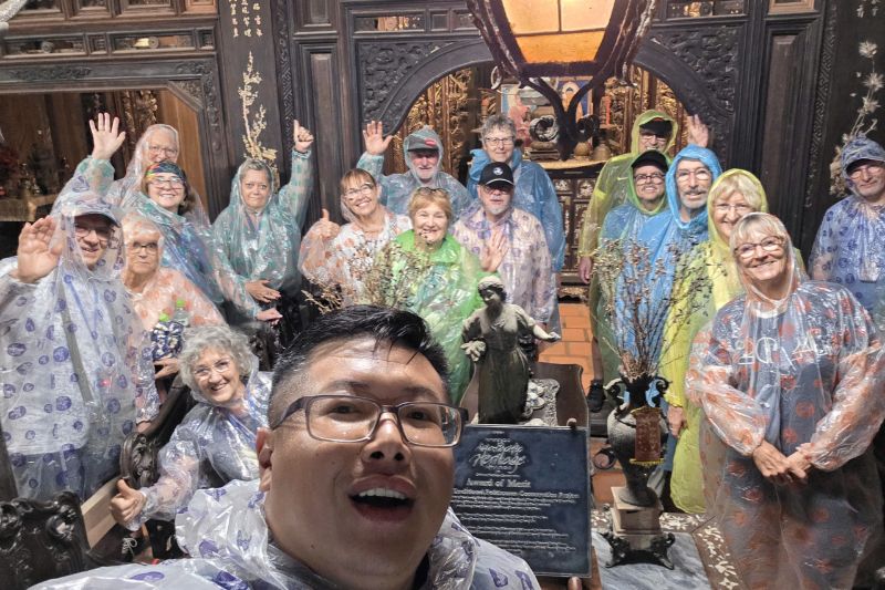 Optimistic travelers during the rainy season in Vietnam and our guide Hieu Nhan